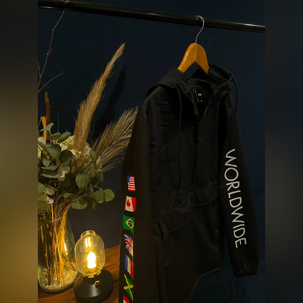 Black Huf Worldwide windbreaker hoodie with half zipper, medium size